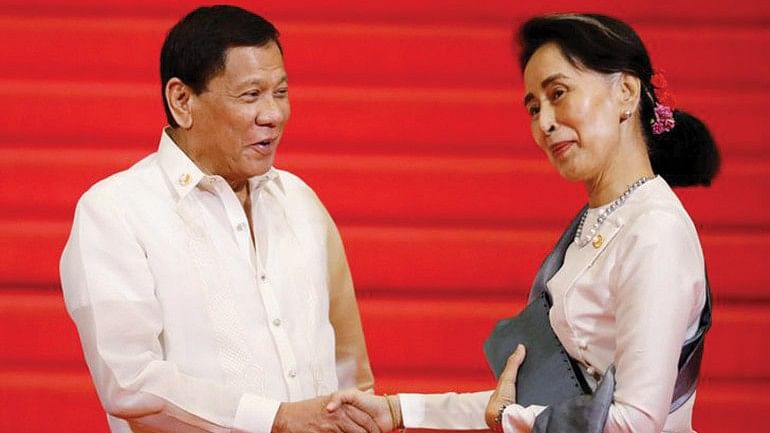 A file photo shows Philippines’ Duterte greeting Myanmar State Counsellor Aung San Suu Kyi before the start of the 30th Asean Summit in Manila in April.