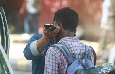 A student talks over cell phone. (File Photo: IANS)