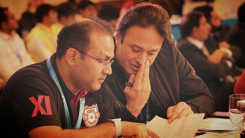 Kings XI Punjab’s mentor Virender Sehwag and co-owner Ness Wadia discuss a player during the IPL Auction 2018.&nbsp;