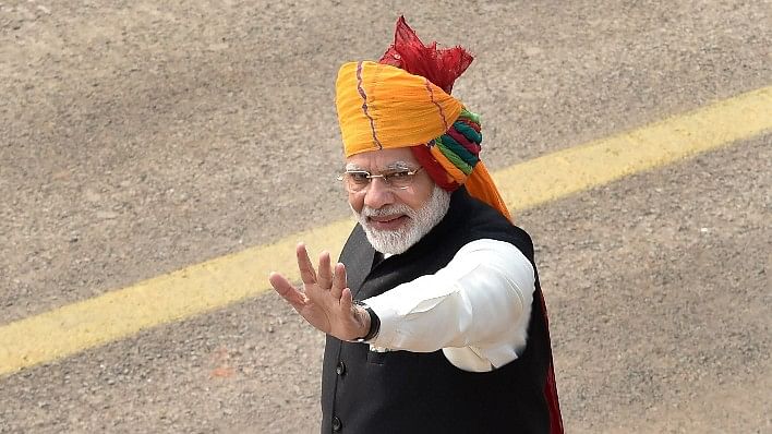  Prime Minister Narendra Modi waves at the crowd during the 69th Republic Day Parade at Rajpath in New Delhi, on Friday.&nbsp;