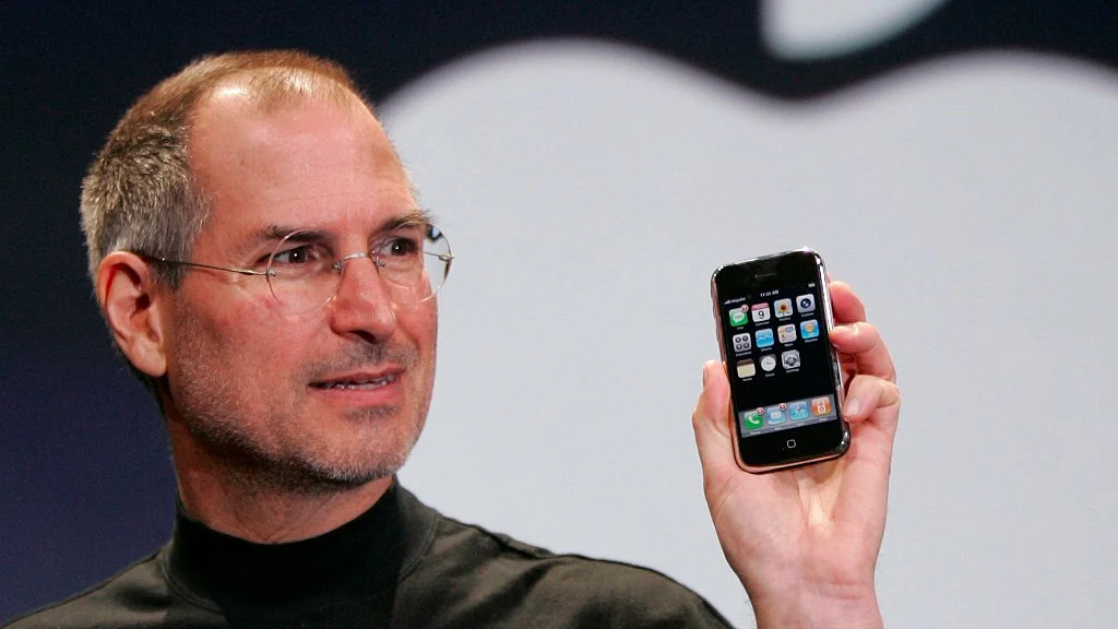 Steve Jobs with the first iPhone on 9 January 2007. 
