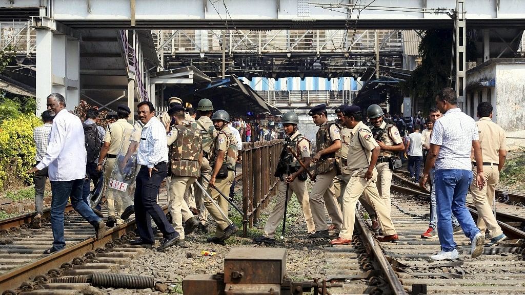  Mumbai police officials patrolling the city.