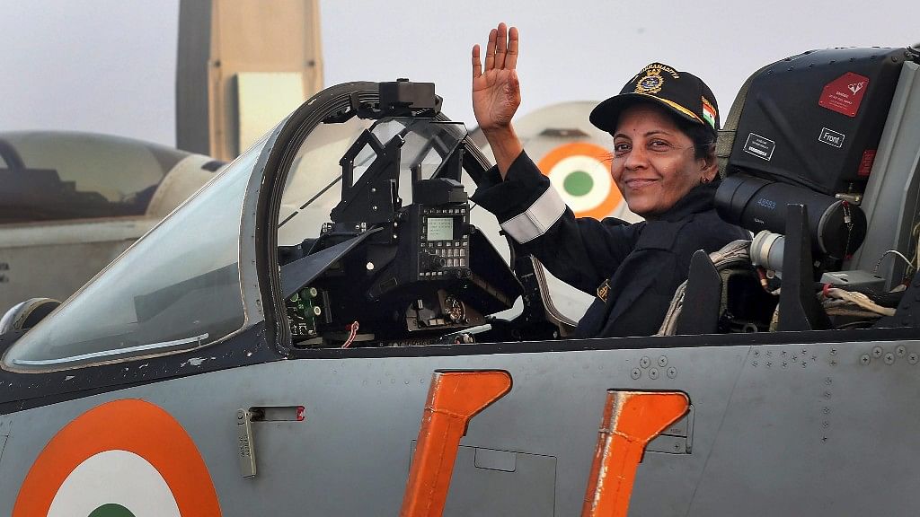 Defence Minister Nirmala Sitharaman waves from the cockpit of an MiG 29K&nbsp;