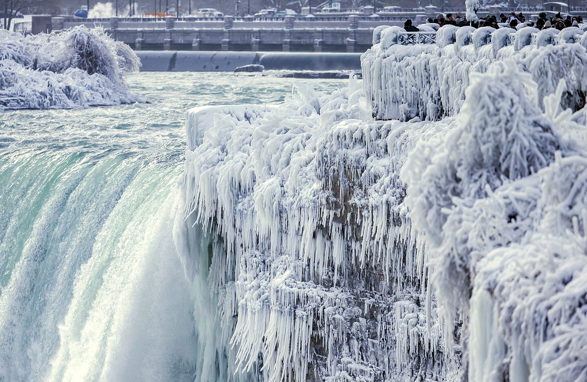 The party frozen Niagara fall is a sight to behold. The white cascade of water fall makes it look like heaven.