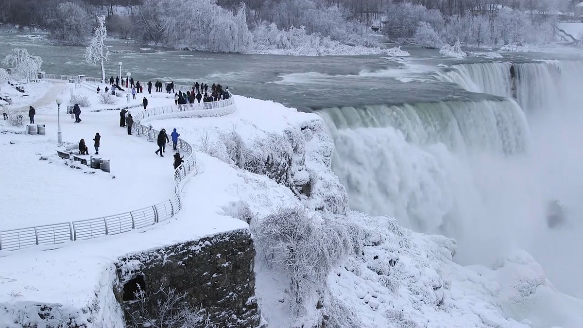The party frozen Niagara fall is a sight to behold. The white cascade of water fall makes it look like heaven.