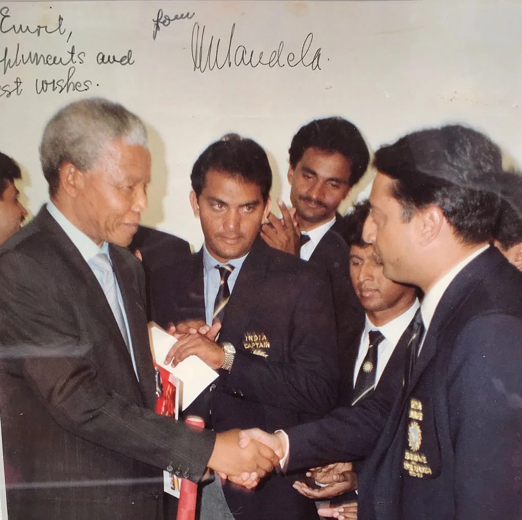 My treasured possession is a photograph with Nelson Mandela, signed: To Emrit, Mandela.