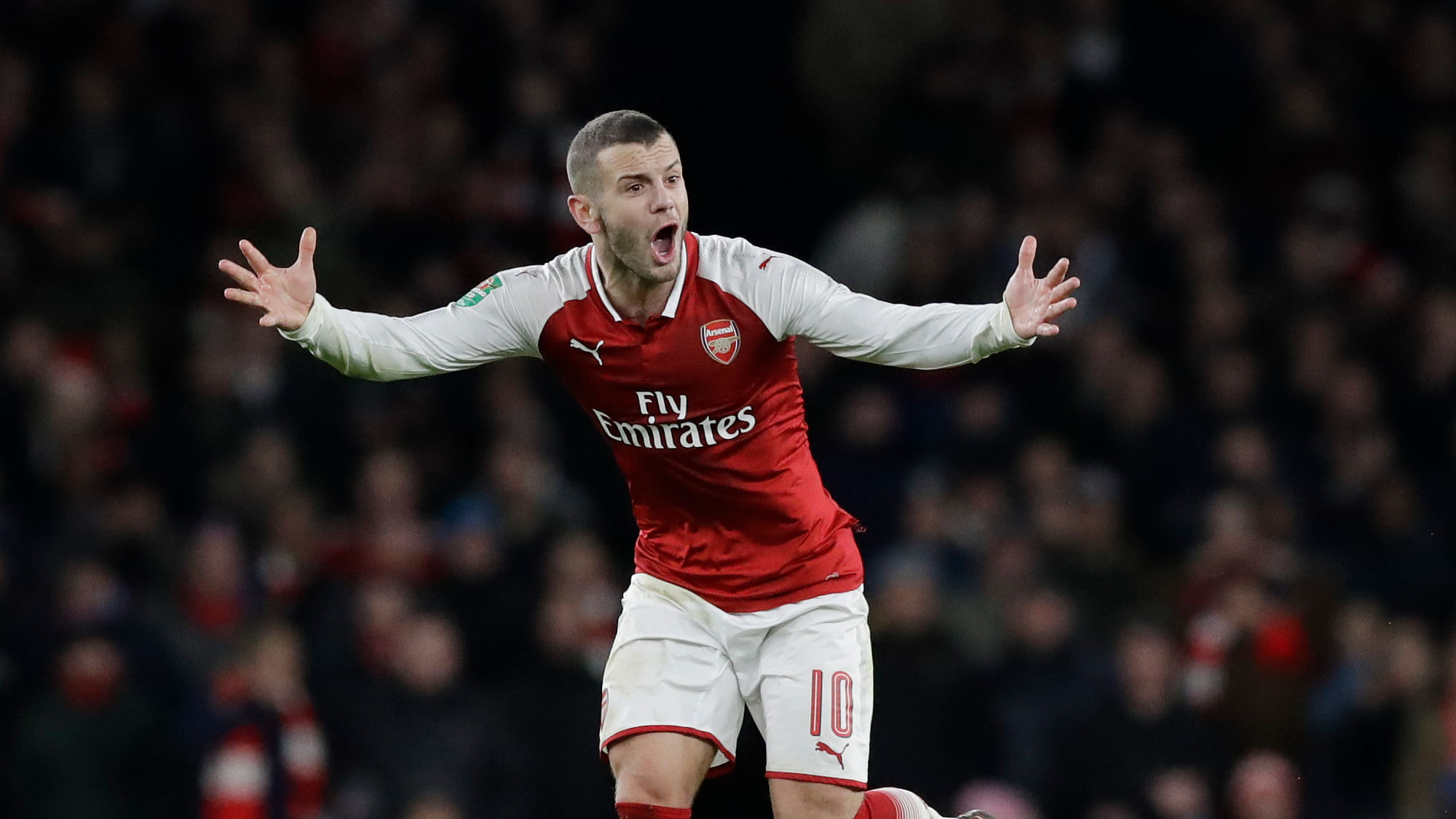Arsenal’s Jack Wilshere shouts during the English League Cup semifinal second leg  match against Chelsea at the Emirates stadium.