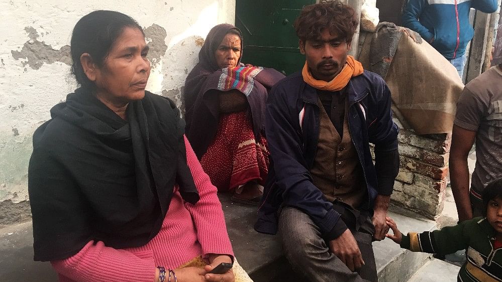 Family members of the deceased grieve the loss of their loved ones in the Bawana factory fire.&nbsp;