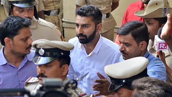 Youth Congress general secretary Mohammed Haris Nalapad being taken away by the police for allegedly assaulting a person in Bengaluru on Monday, 26 February. 