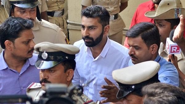 Son of MLA NA Haris and Youth Congress general secretary Mohammed Haris Nalapadbeing taken away by the police for allegedly assaulting a person in Bengaluru on Monday, 26 February.&nbsp;