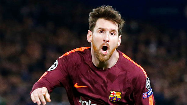 Lionel Messi celebrates after scoring his first-ever goal against Chelsea.