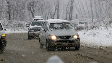 A file image of vehicles moving through the snow-covered streets in Srinagar. Image used for representational purpose only.
