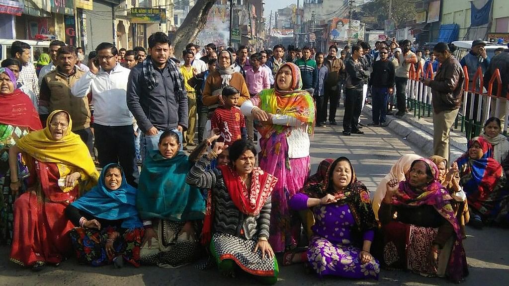 Chandan Gupta’s kin stage a protest along with locals in violence-hit Kasganj on Tuesday. Gupta was shot dead in communal clashes.