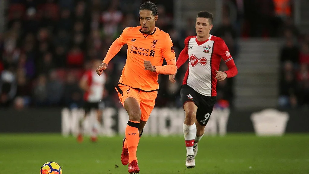 Liverpool’s Virgil van Dijk (left) and Southampton’s Guido Carrillo battle for the ball during their at St Mary’s Stadium on Sunday.