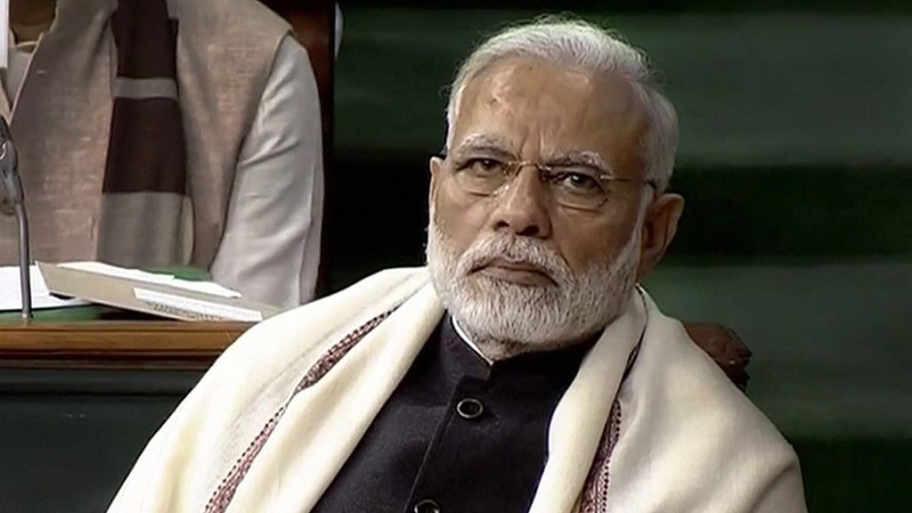  Prime Minister Narendra Modi listens as Union Finance Minister Arun Jaitley (unseen) presents the Union Budget at Parliament, in New Delhi on Thursday.