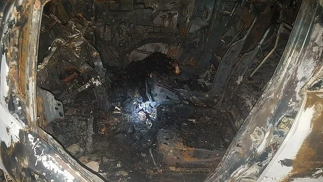 The security guard of the apartment called the fire station after he noticed some smoke emanating from the car.