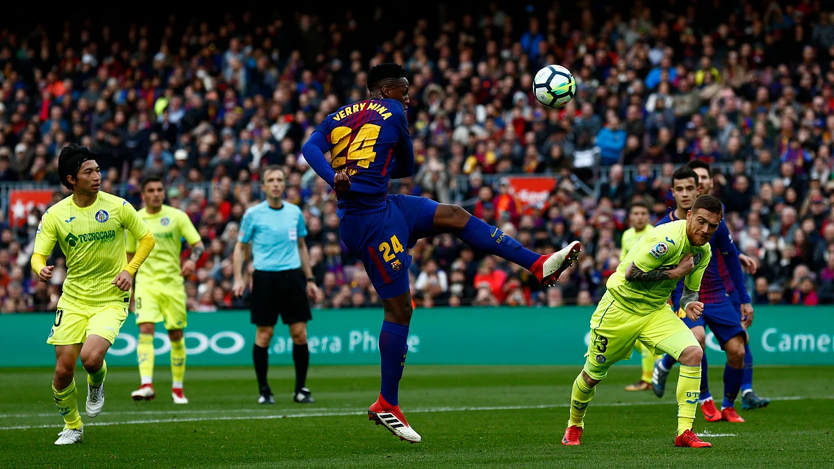 Barcelona’s Yerry Mina (centre) kicks the ball during the Spanish La Liga match between Barcelona and Getafe at Camp Nou.