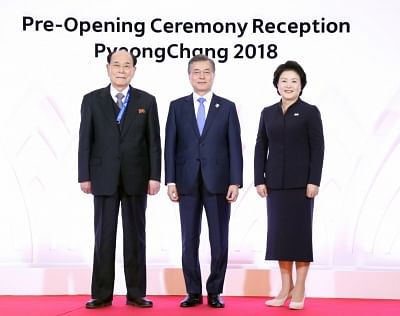 PyeongChang: South Korean President Moon Jae-in (C) and first lady Kim Jung-sook (R) pose with Kim Yong-nam, North Korea
