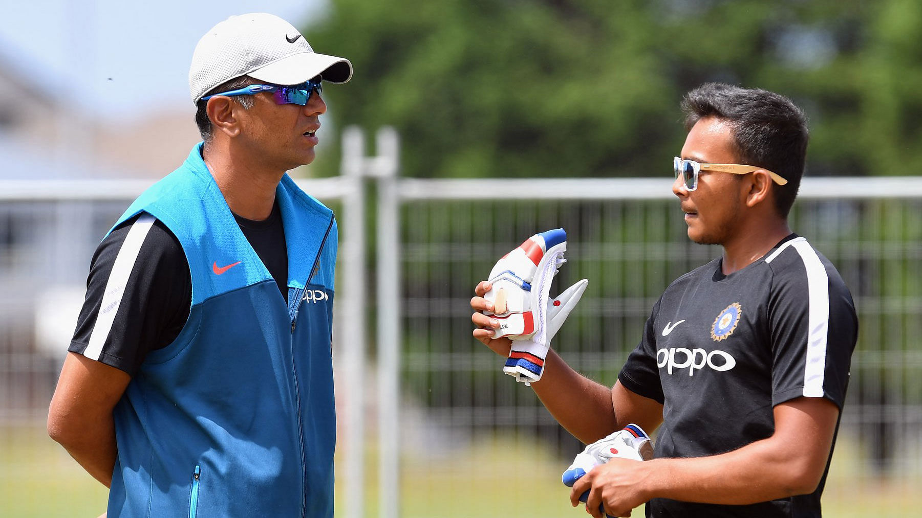 India U-19 coach Rahul Dravid and captain Prithvi Shaw have a chat during a practice session.