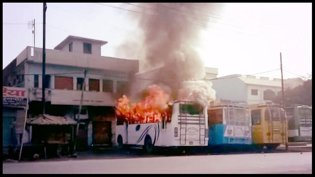  A bus set on fire by an irate mob as two communities clashed in the Kasganj district of Uttar Pradesh on 26 January 2018.&nbsp;