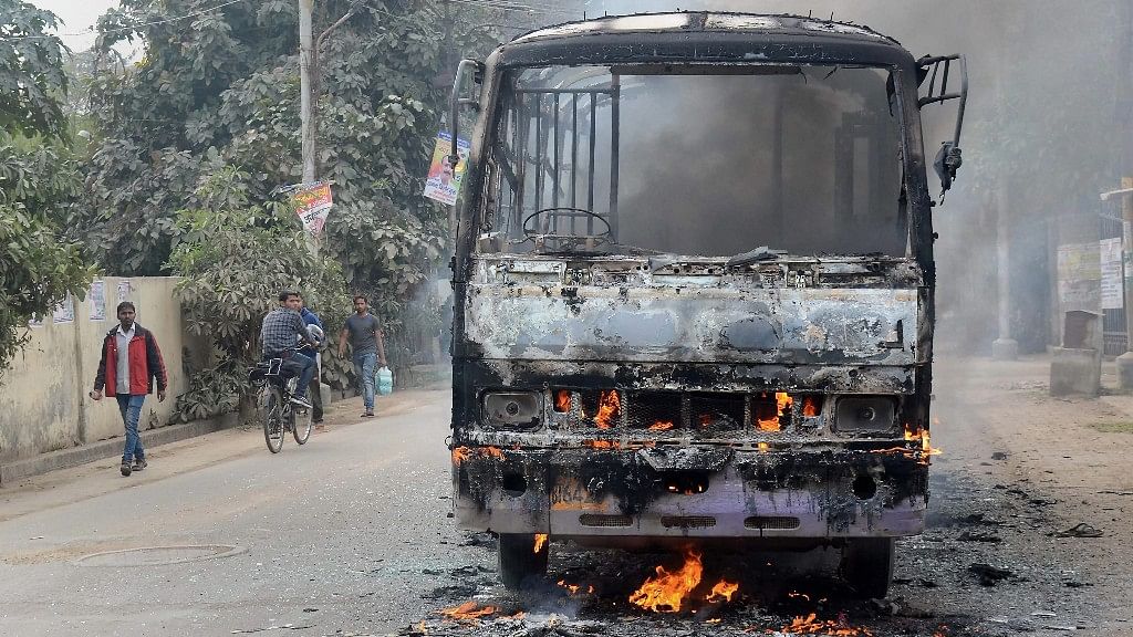 A  city bus that was set ablaze by angry students of the Allahabad Central University while protesting the brutal murder of a law student in Allahabad on Monday, 12 February.