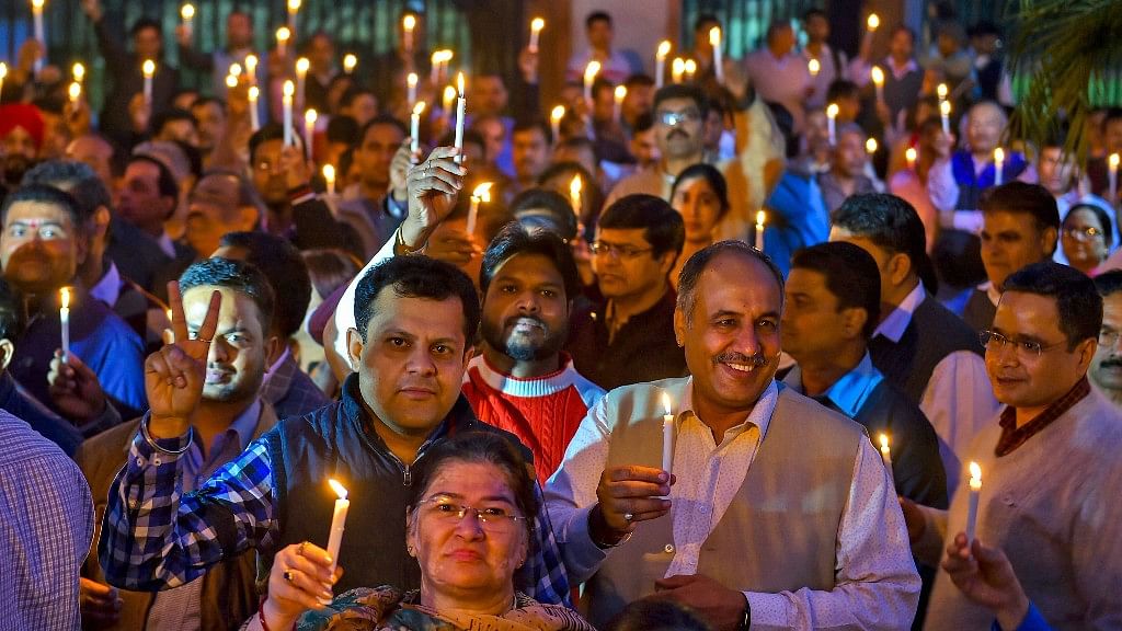 IAS officers and other officials take part in a candlelight protest over alleged manhandling of Delhi Chief Secretary Anshu Prakash
