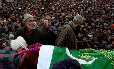 Shopian: People participate in the funeral procession of a 19-year-old Rayees Ahmad who was injured in security force firing in Shopian district succumbed to injuries at Sher-e-Kashmir Institute of Medical Sciences (SKIMS); at Narpora village of Shopian district on Jan 31, 2018. (Photo: IANS)