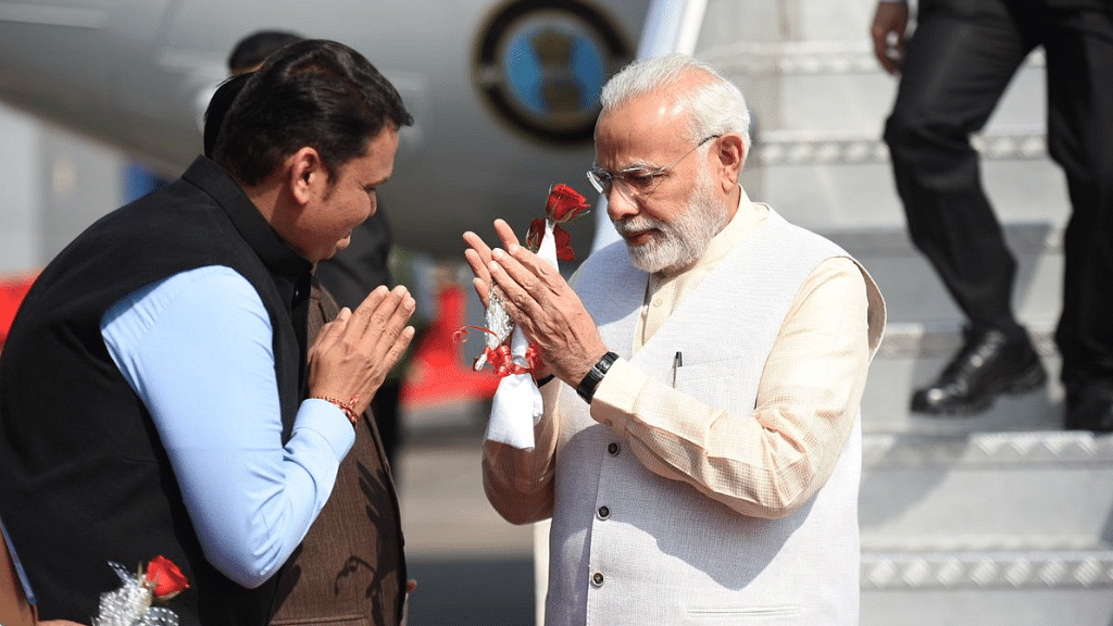 PM Narendra Modi greeted by Maharashtra CM Devendra Fadnavis in Mumbai.