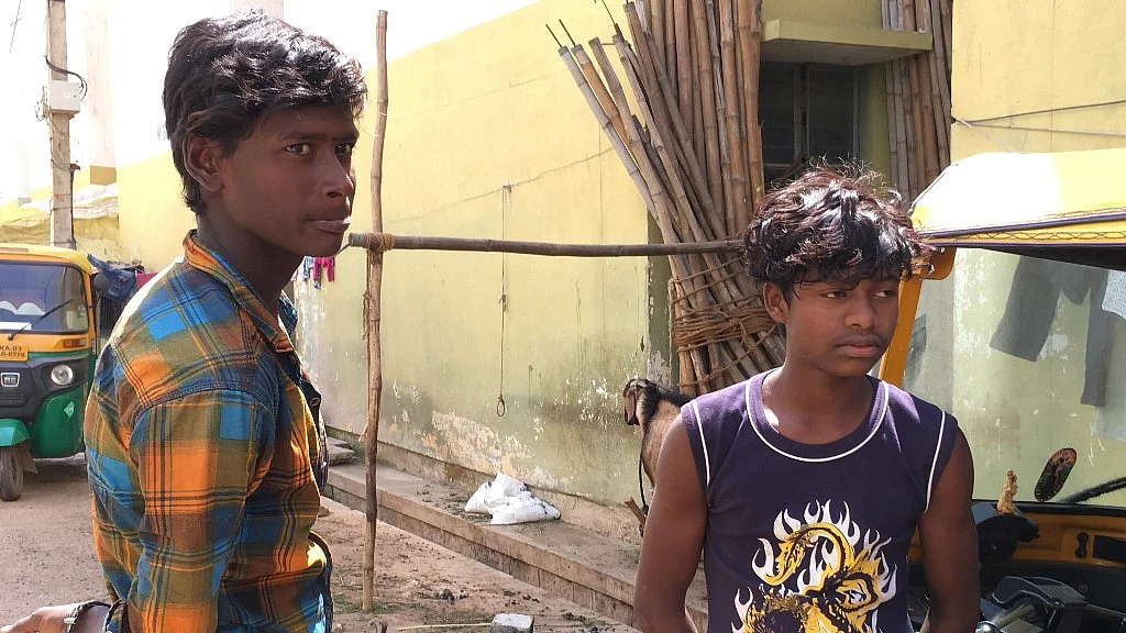 Rajini Raja (left) and his friend dropped out of school after being evicted from Veerabhadra Nagar, Bengaluru.