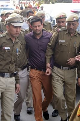 Aam Aadmi Party MLA Prakash Jarwal being taken to be produced at Tees Hazari Court in connection with alleged attack on Delhi Chief Secretary Anshu Prakash, in New Delhi on Feb 21, 2018. (Photo: IANS)