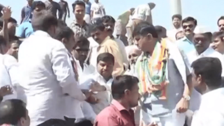 Karnataka Energy Minister DK Shivakumar hits at a man’s hand trying to take a selfie with him
