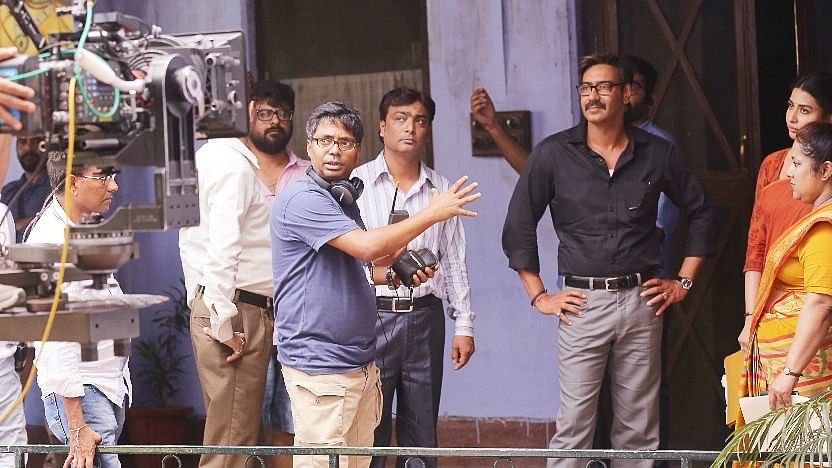 Filmmaker Raj Kumar Gupta on the sets of <i>Raid </i>with Ajay Devgn.