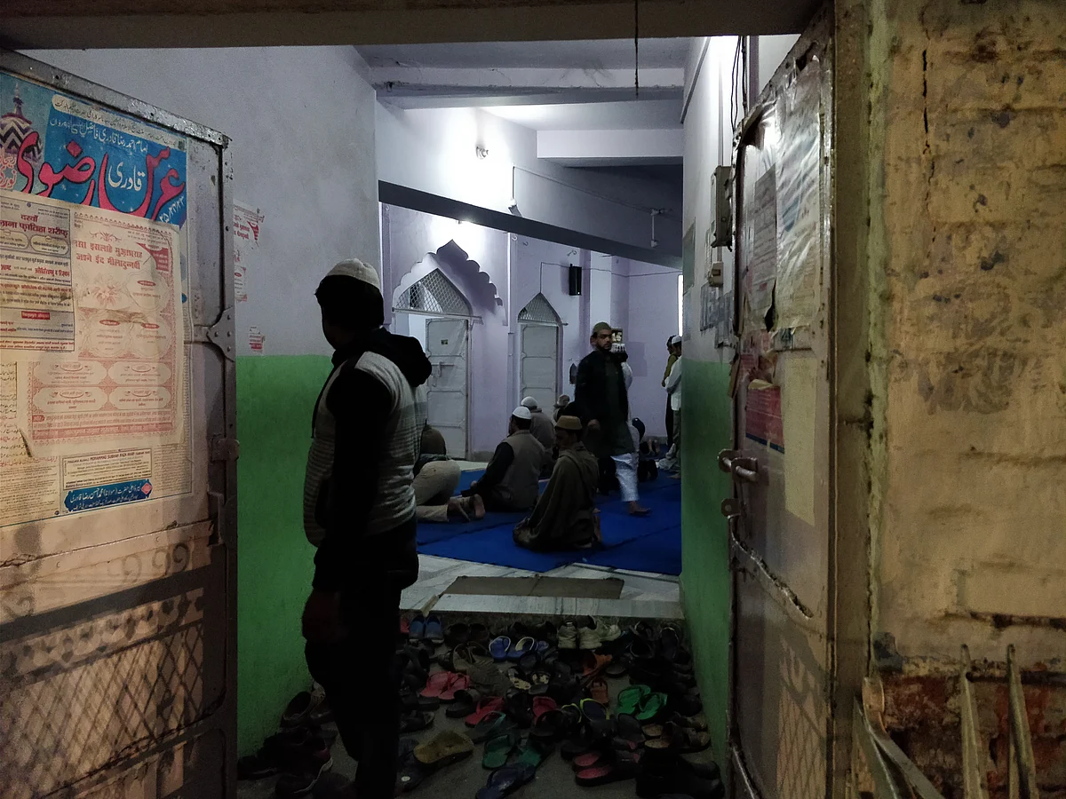 Muslims emerging from a mosque after evening prayers. 