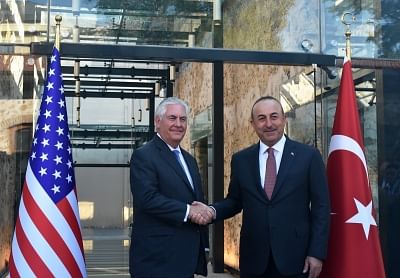 ISTANBUL, July 10, 2017 (Xinhua) -- Turkish Foreign Minister Mevlut Cavusoglu (R) shakes hands with visiting U.S. Secretary of State Rex Tillerson in Istanbul, Turkey, July 9, 2017. Mevlut Cavusoglu and Turkish President Recep Tayyip Erdogan had separate meetings on Sunday in Istanbul with Rex Tillerson, as the two NATO allies are sharply divided over Syria. (Xinhua/Zeynep Cermen/IANS)