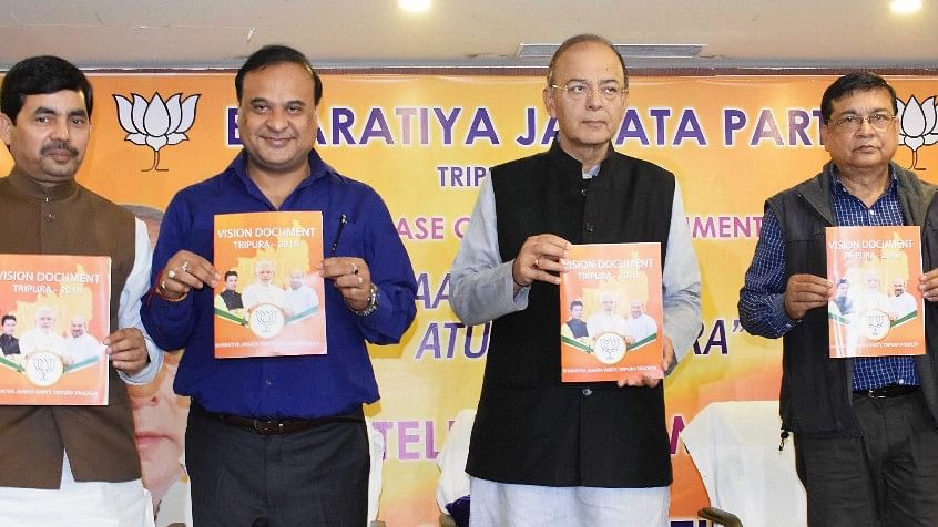  Senior BJP leader and Finance Minister Arun Jaitley along with party leaders Syed Shahnawaj and Himanta Biswa Sarma releases partys vision document for the Assembly polls in Agartala on Sunday.