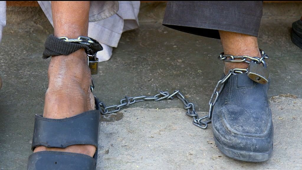 A former warlord and a Talib chained together at a mental health unit in Herat, WEstern Afghanistan.&nbsp;