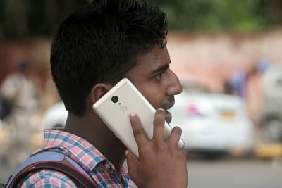 A man talks over cell phone. (File Photo: IANS)
