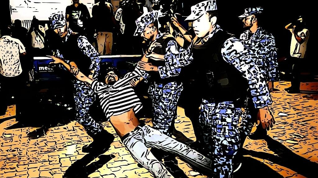 A protester is dragged away by members of the Maldivian Defence Force.