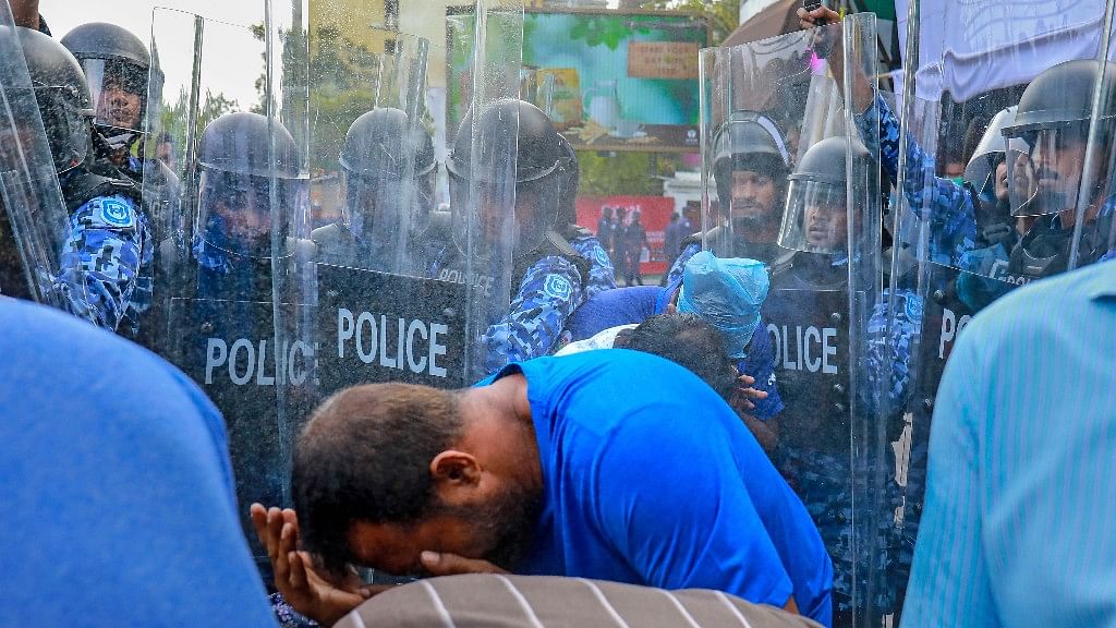 Policemen use pepper spray to disperse pro-opposition supporters during a protest in Male, Maldives.&nbsp;