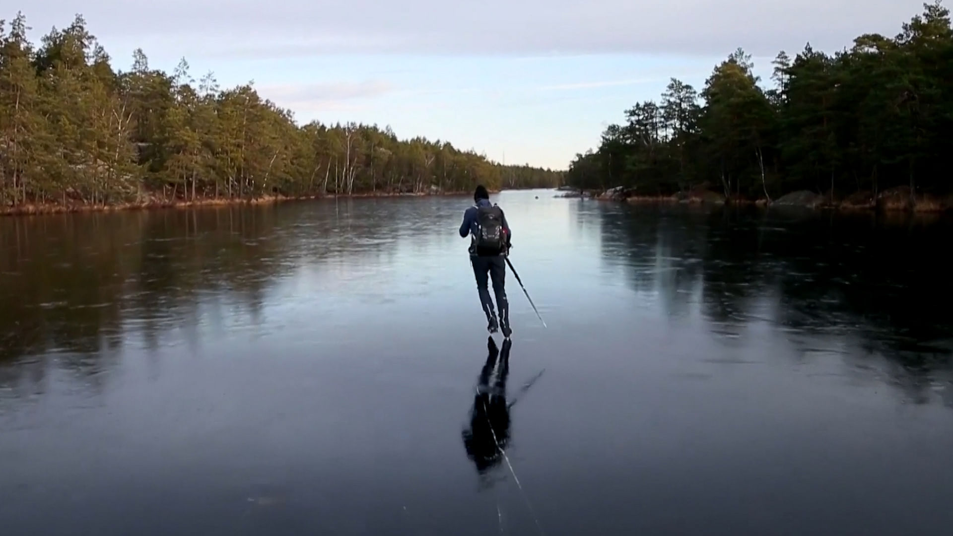 Marten Ajne slides over a frozen lake In Sweden.