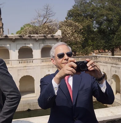 Hyderabad: US Ambassador to India Kenneth I. Juster clicks pictures with his camera during his visit to the Qutub Shahi Tombs in Hyderabad on Feb 28, 2018. (Photo: IANS)