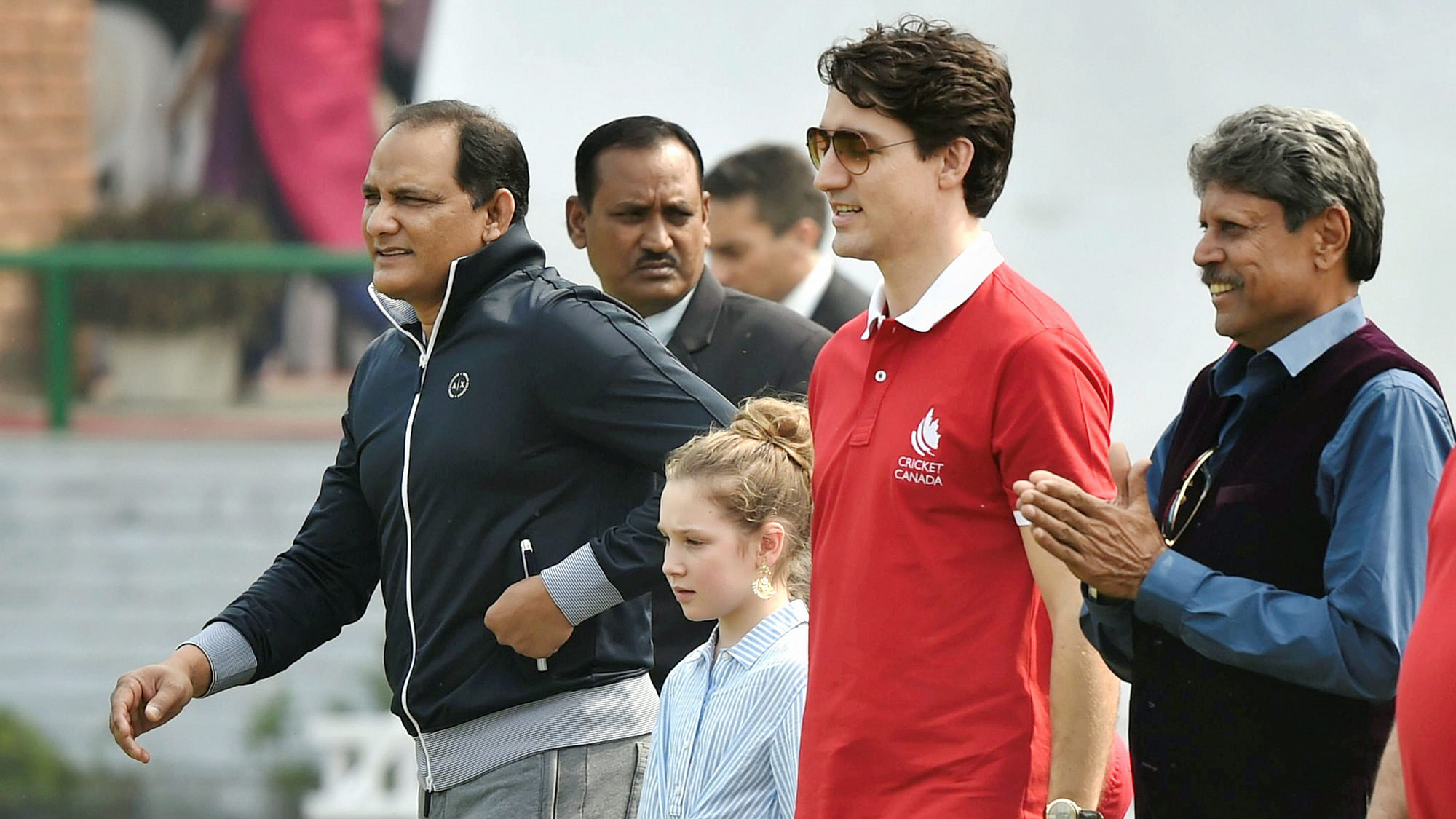 Canadian Prime Minister Justin Trudeau with former India captains Mohammad Azharuddin and Kapil Dev in New Delhi.