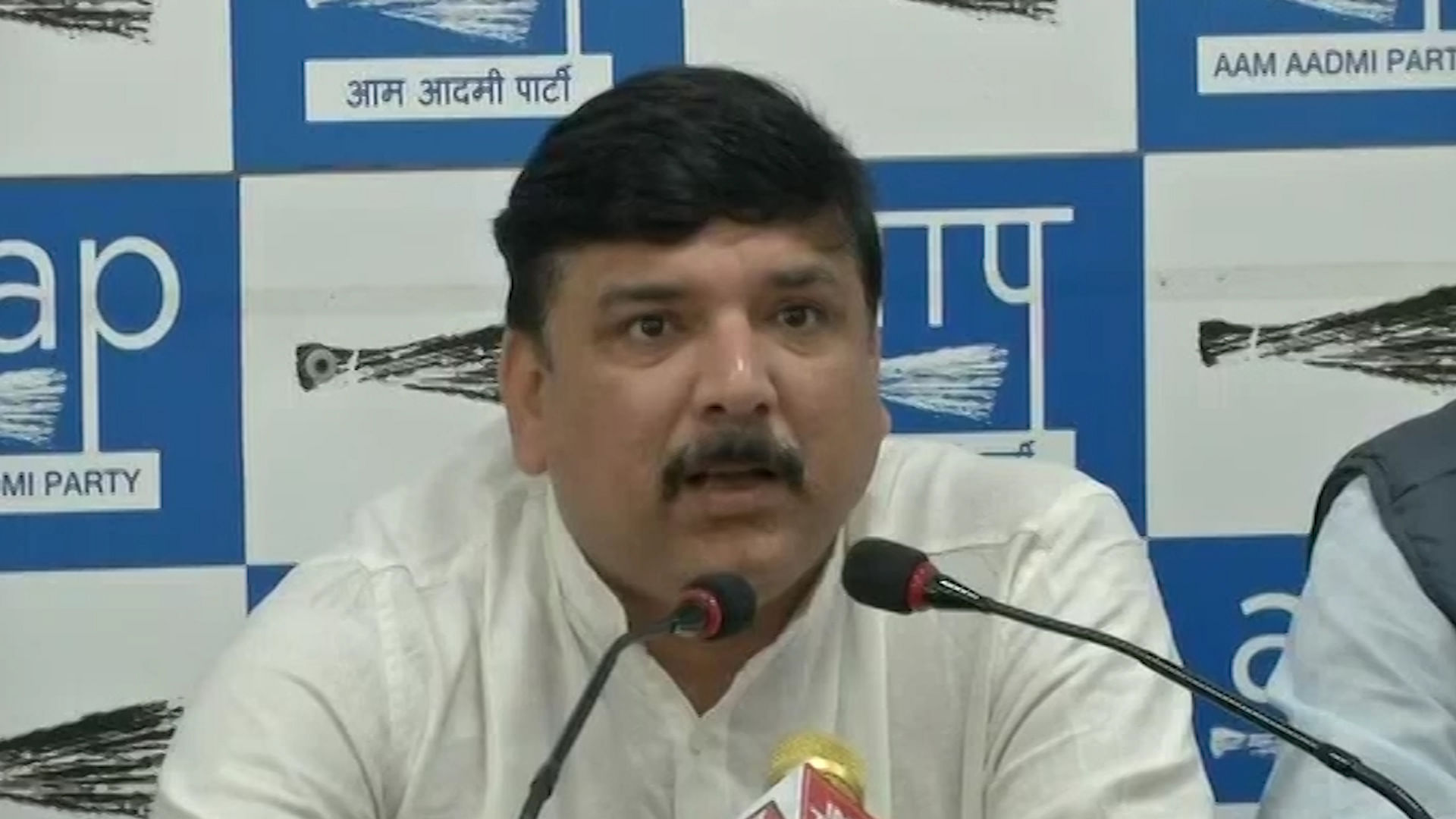 AAP’s Sanjay Singh addresses a press conference.