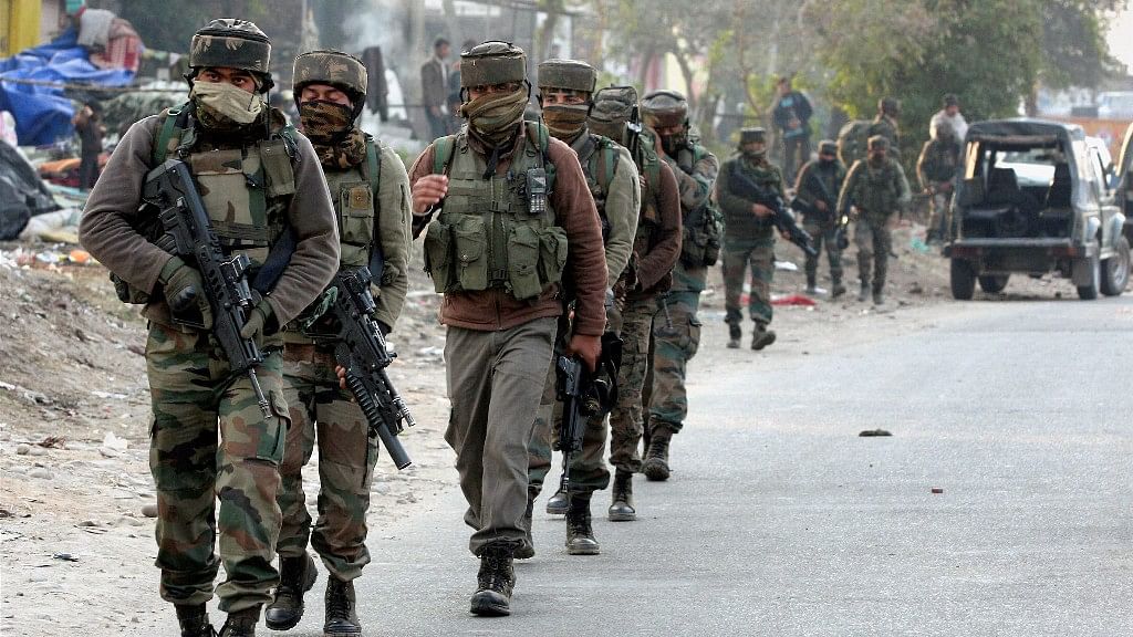 Security personnel take positions during a militants attack at Sunjwan Army camp in Jammu on 10 February.&nbsp;