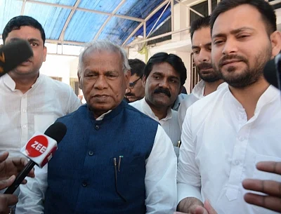 Patna: Hindustani Awam Morcha-Secular (HAM-S) Jitan Ram Manjhi along with RJD leaders Tejashwi Yadav and Tej Pratap Yadav in Patna on Feb 28, 2018. The Hindustani Awam Morcha-Secular (HAM-S) on Wednesday announced its exit from the National Democratic Alliance (NDA) with the BJP and said it would be joining the Grand Alliance led by the Rashtriya Janata Dal. (Photo: IANS)