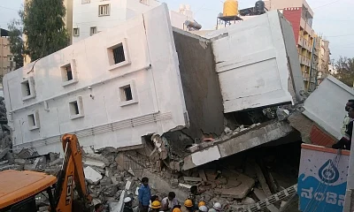 Bengaluru: Rescue operations underway at the site where a four-storeyed under-construction building collapsed killing three construction workers in Bengaluru, on Feb 15, 2018. (Photo: IANS)