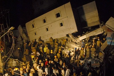 Bengaluru: Rescue operations underway at the site where a four-storeyed under-construction building collapsed killing three construction workers in Bengaluru, on Feb 15, 2018. (Photo: IANS)