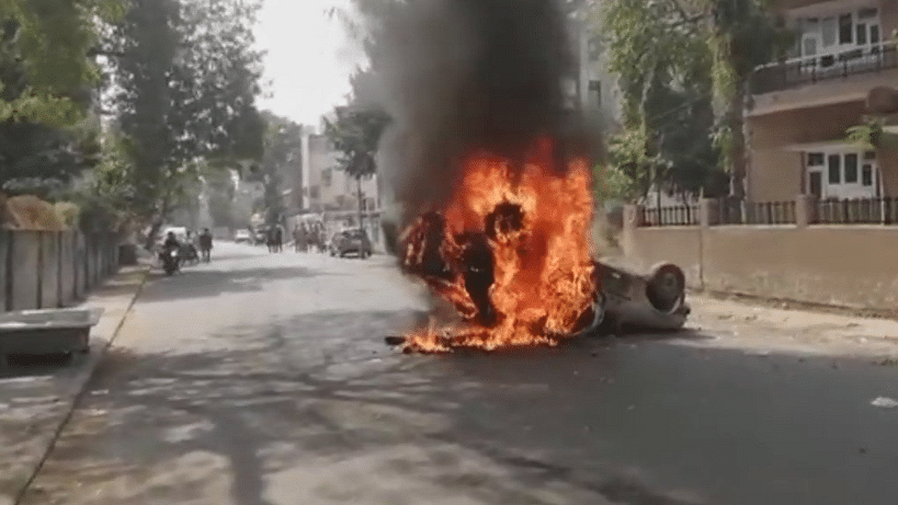 Protesters torch vehicle in Ahmedabad agitating over the death of a Dalit activist Bhanubhai Vankar.