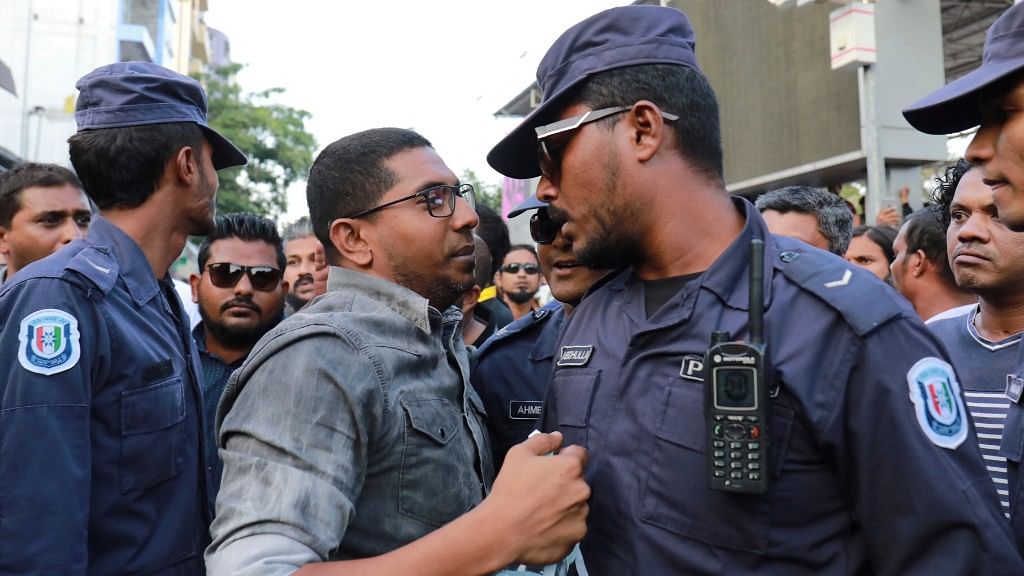 Maldivian opposition supporters scuffle with security forces officers during a protest demanding the release of political prisoners in Male, Maldives, on 2 February 2018.