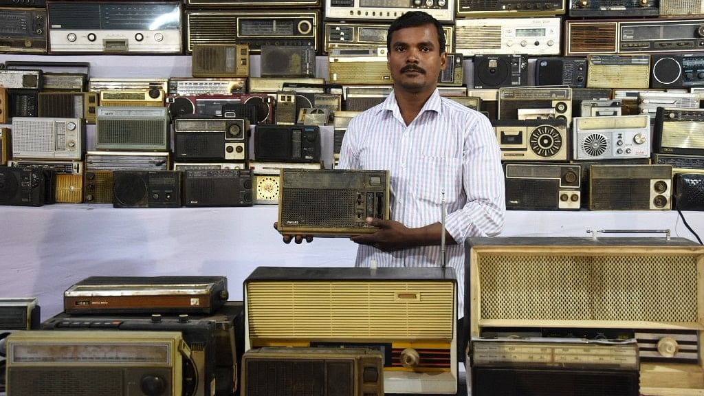 Rajendra Sahu displays one of his radios from his vintage collection.
